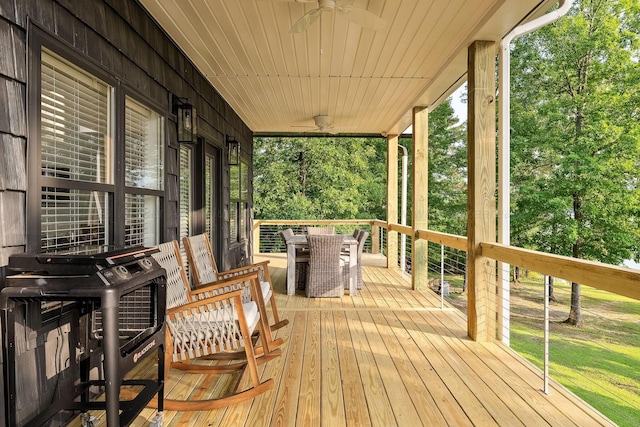 wooden deck featuring ceiling fan