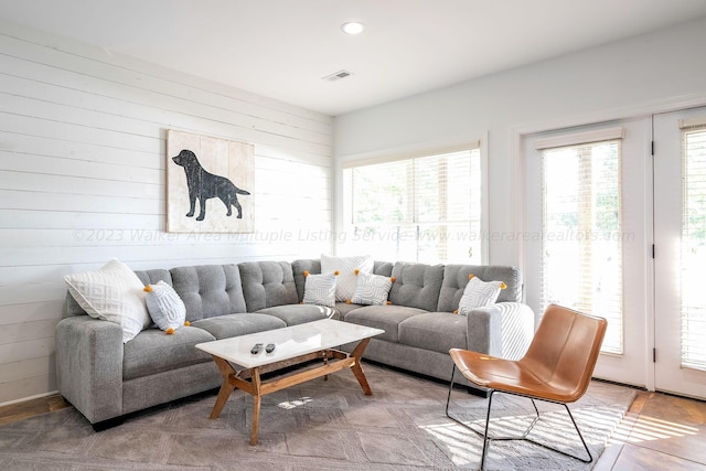 living room featuring wood walls