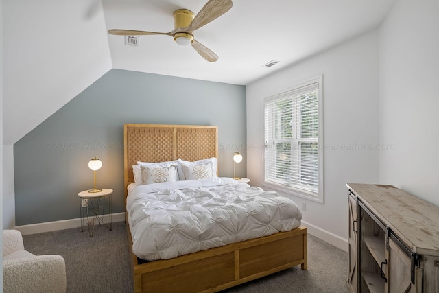 carpeted bedroom with lofted ceiling and ceiling fan