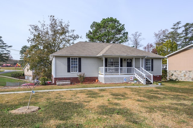 single story home featuring a front yard and covered porch