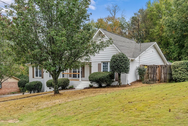 obstructed view of property featuring a front lawn