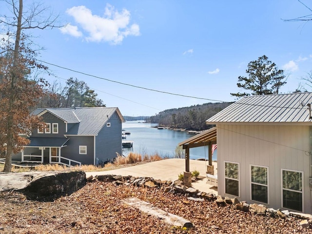 view of side of home featuring a water view