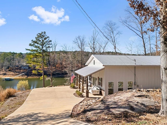 view of side of property with a water view