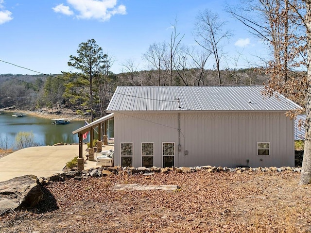 view of home's exterior with a water view