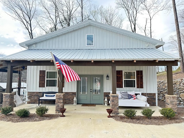 view of front facade featuring french doors and a porch