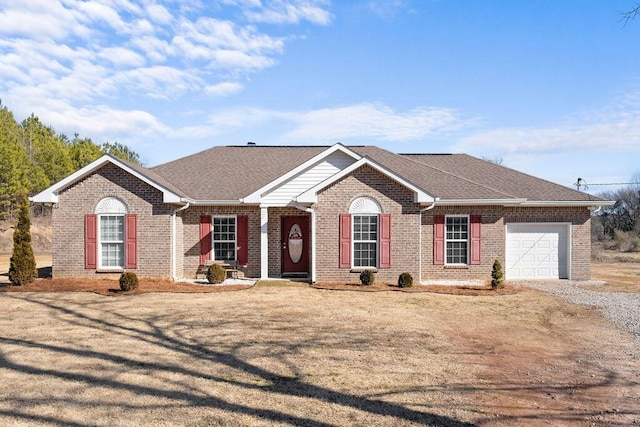 ranch-style house featuring a garage