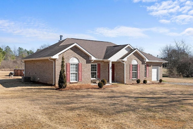 ranch-style house featuring central AC and a front lawn