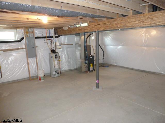 basement featuring heating utilities and gas water heater