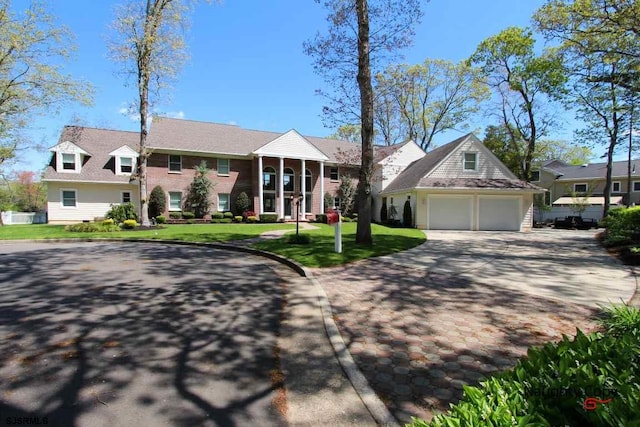 view of front of home featuring a front yard and a garage