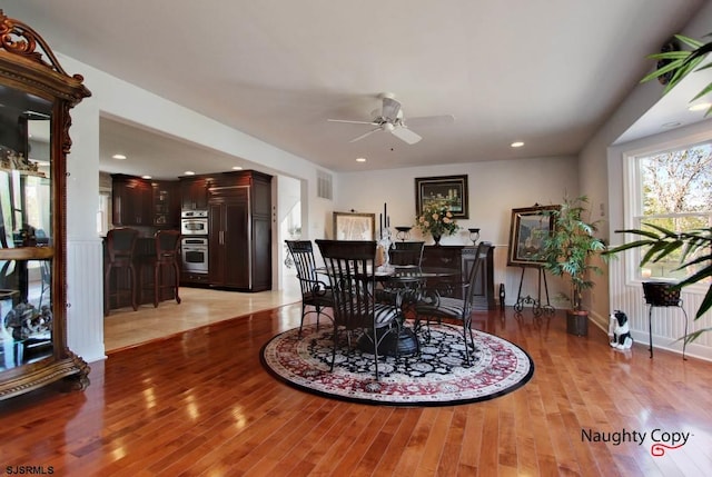 tiled dining area featuring ceiling fan