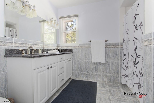 bathroom featuring tile flooring, tile walls, backsplash, and vanity