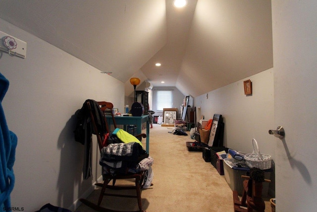 interior space featuring light colored carpet and lofted ceiling