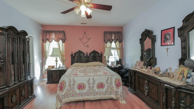 bedroom featuring ceiling fan and light hardwood / wood-style floors