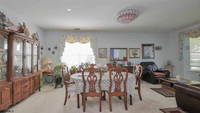 view of carpeted dining area