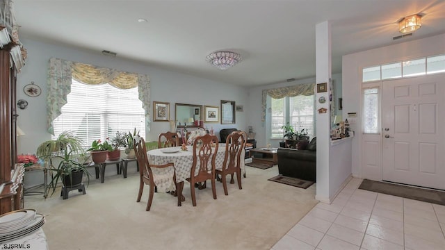 dining room featuring light tile floors