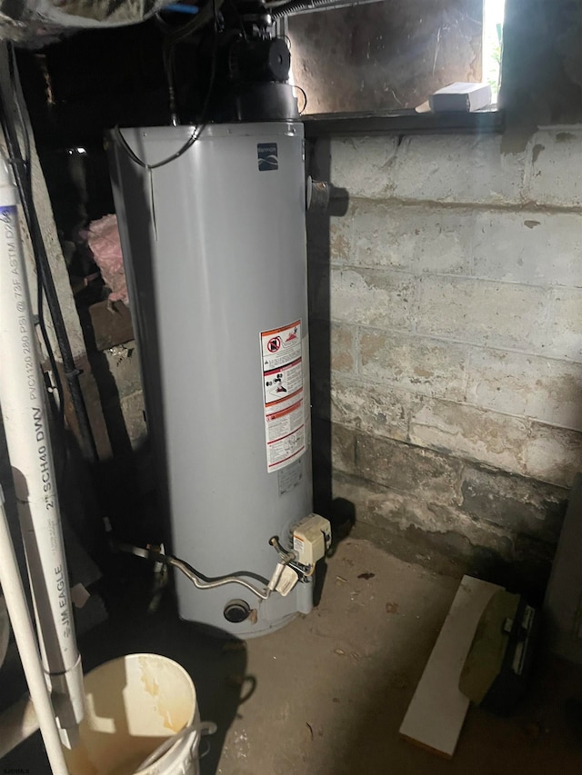 utility room with water heater