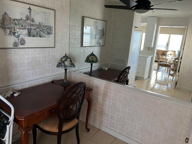 tiled dining area with ceiling fan