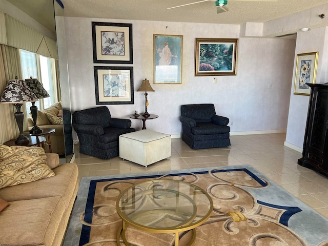 tiled living room featuring a textured ceiling