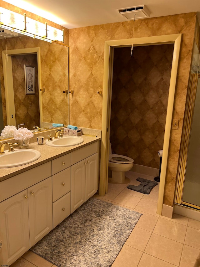 bathroom with tile patterned floors, vanity, and toilet