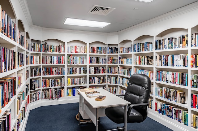 carpeted office featuring crown molding