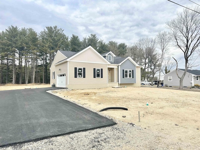 view of front of house with a garage and driveway