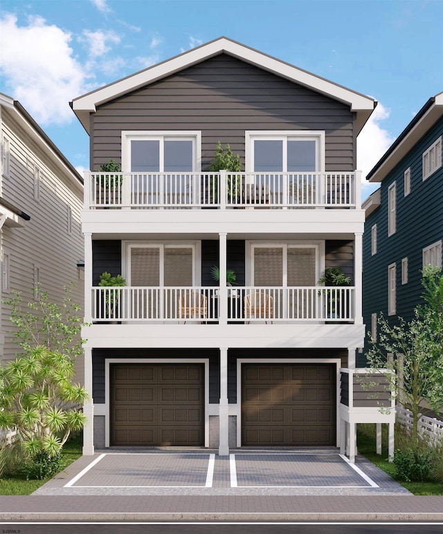 view of front of property featuring a balcony and a garage