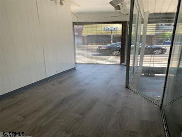 hallway featuring dark hardwood / wood-style floors