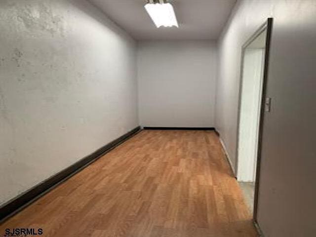 corridor featuring light hardwood / wood-style flooring