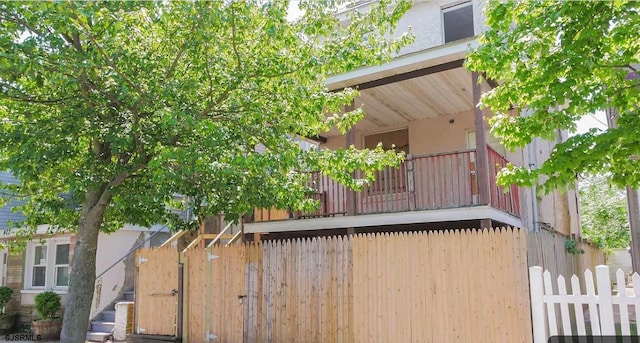 view of property exterior with a balcony