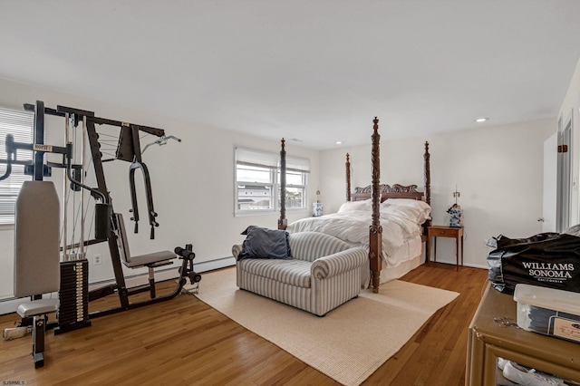 bedroom featuring hardwood / wood-style flooring and multiple windows