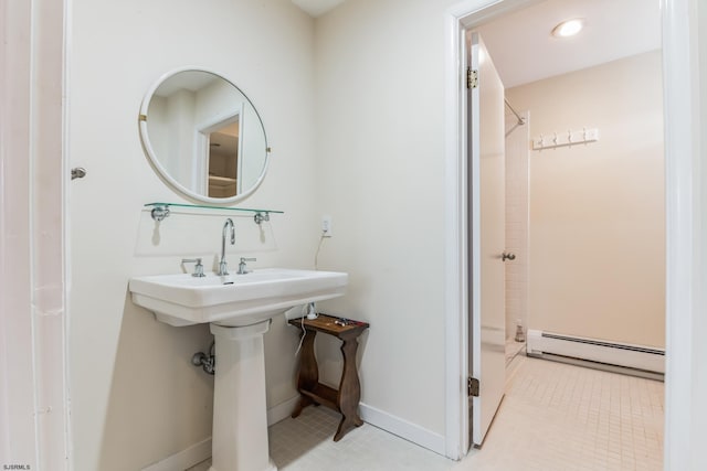 bathroom featuring baseboard heating, tile floors, and a shower