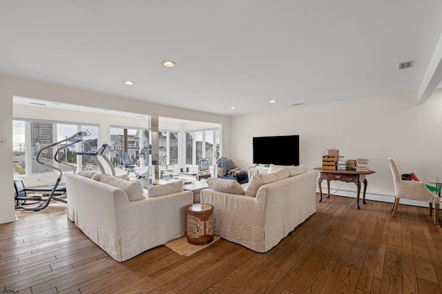 living room with baseboard heating and hardwood / wood-style floors