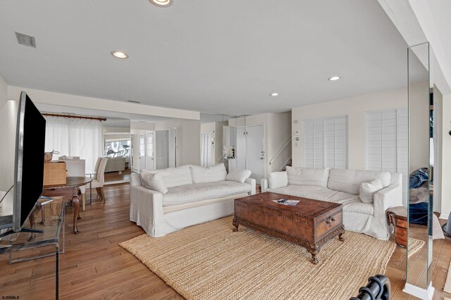 living room with light hardwood / wood-style flooring