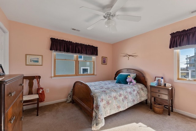 carpeted bedroom featuring ceiling fan