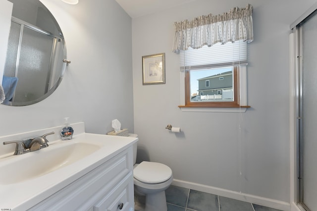 bathroom featuring toilet, tile floors, and vanity