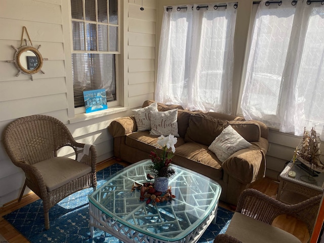 living room with plenty of natural light and hardwood / wood-style floors