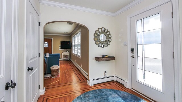 foyer entrance featuring crown molding and dark hardwood / wood-style flooring