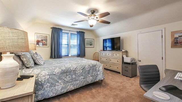 bedroom with ceiling fan, lofted ceiling, and carpet floors