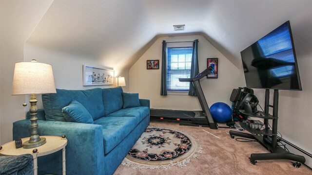 workout room featuring lofted ceiling and light colored carpet