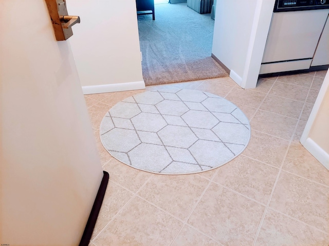 hall with light tile flooring