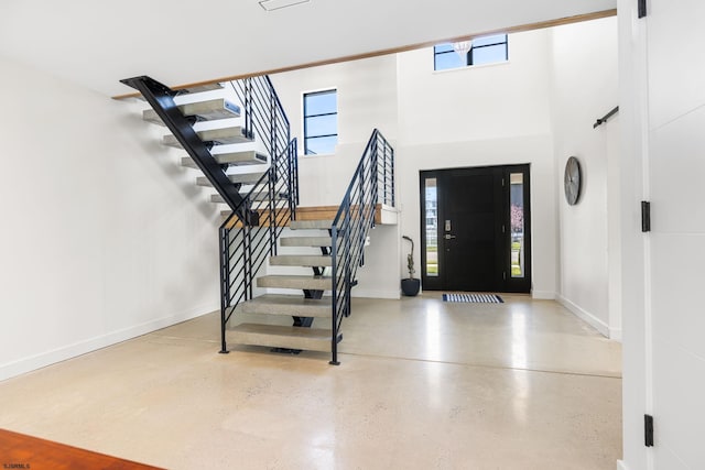 entryway with a high ceiling