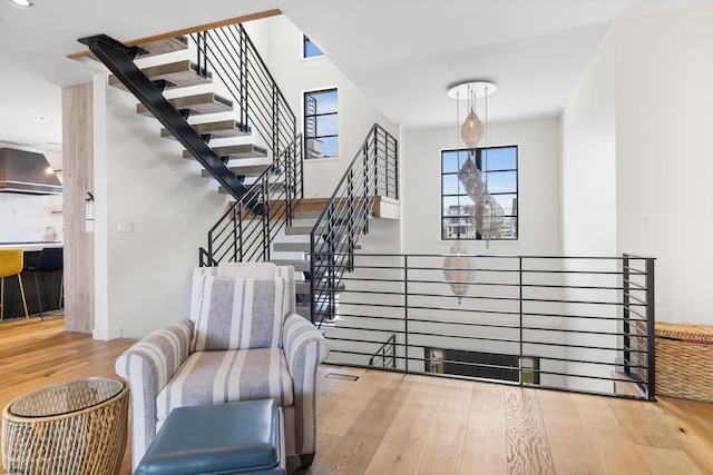 stairs featuring hardwood / wood-style flooring