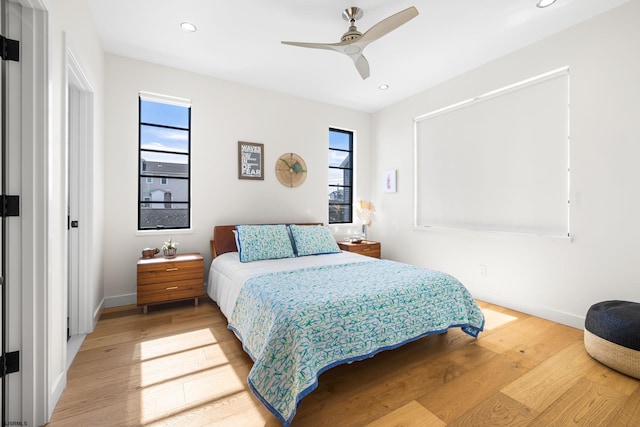 bedroom featuring ceiling fan and light wood-type flooring