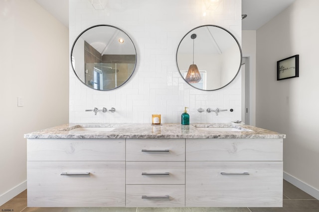 bathroom with tasteful backsplash, tile floors, and dual bowl vanity