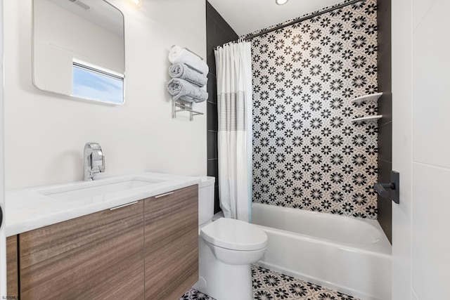 full bathroom with tile floors, oversized vanity, shower / tub combo, and toilet