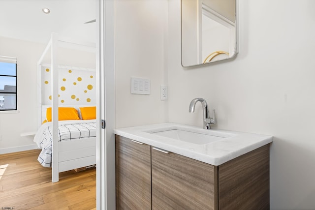 bathroom featuring vanity and hardwood / wood-style flooring