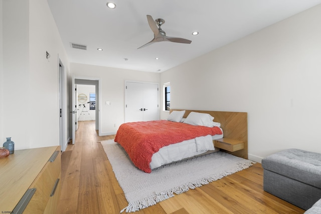 bedroom featuring ceiling fan and hardwood / wood-style flooring