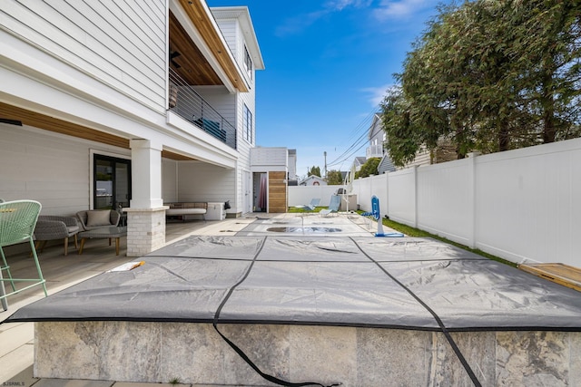 view of pool featuring a patio