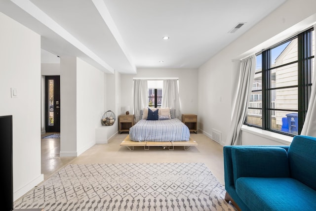 tiled bedroom with multiple windows