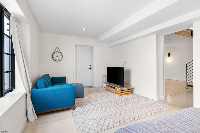 living room with a healthy amount of sunlight and concrete floors